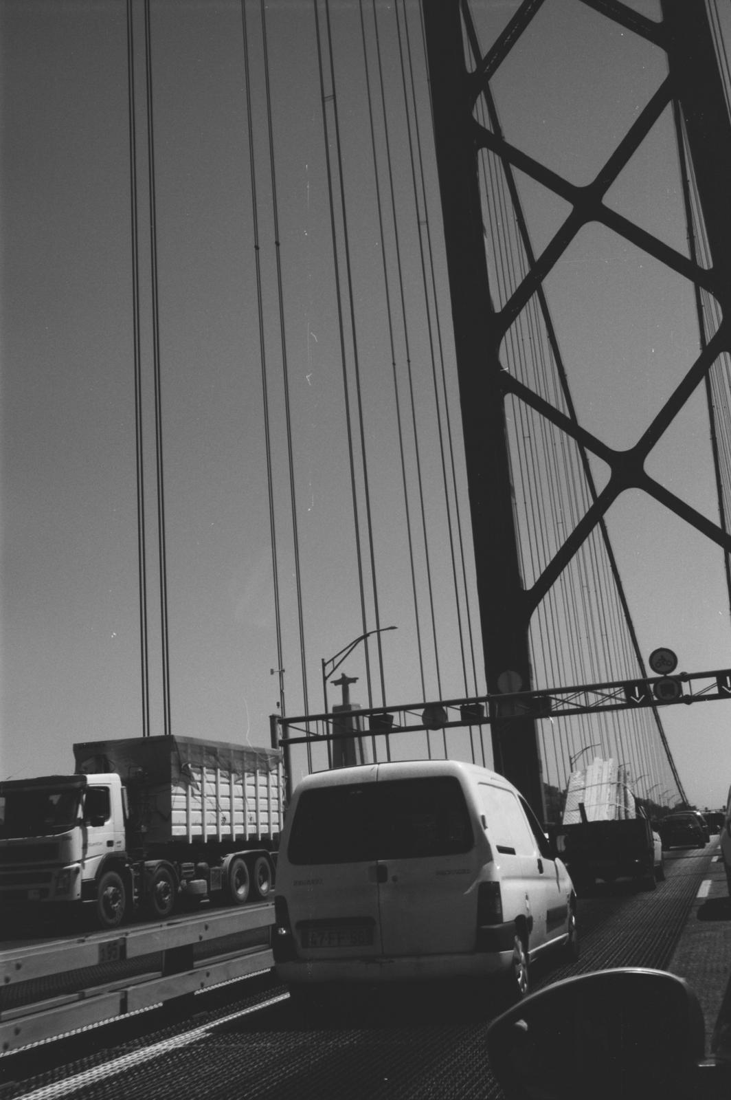 25 de Abril bridge from inside a car, with Cristo Rei silhouetted